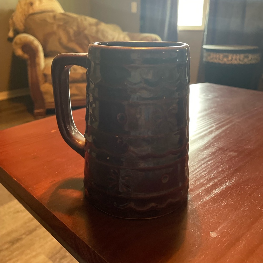 A brown oversize mug made by USA it’s in great condition